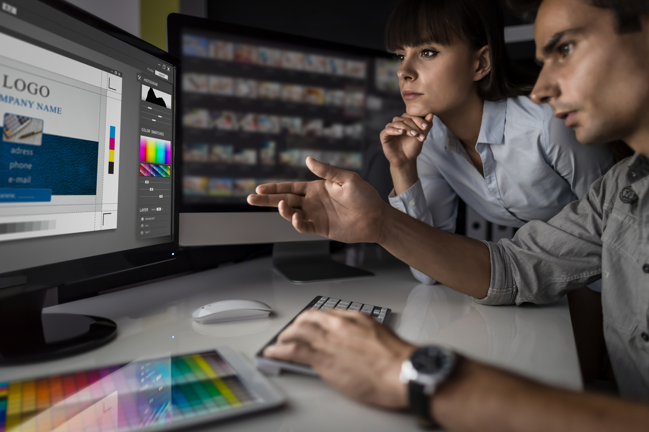 Graphic designer at work. Color samples.