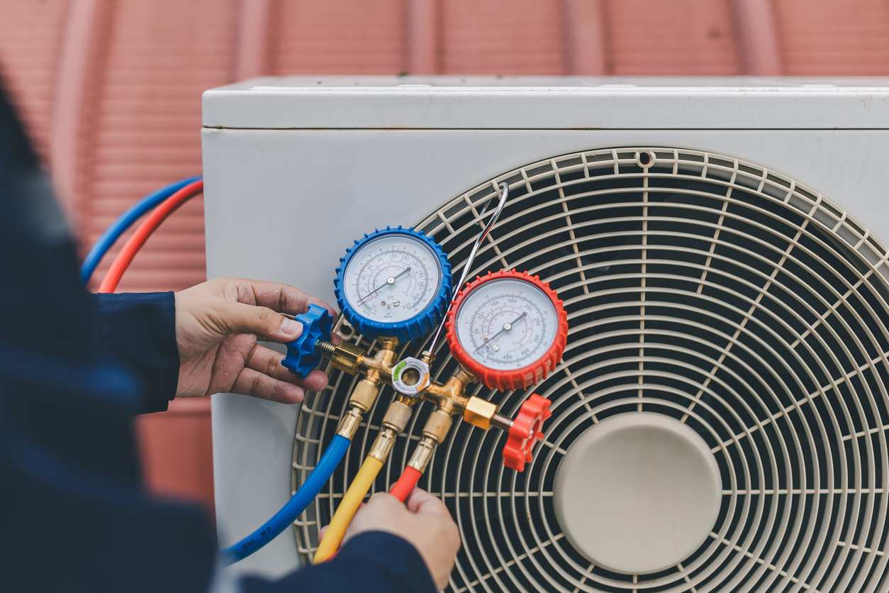 Technician is checking air conditioner AEO Marketing Services 2
